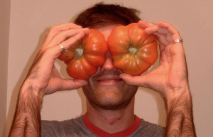 sasquatch man holds mutant-sized tomatoes...news at ten